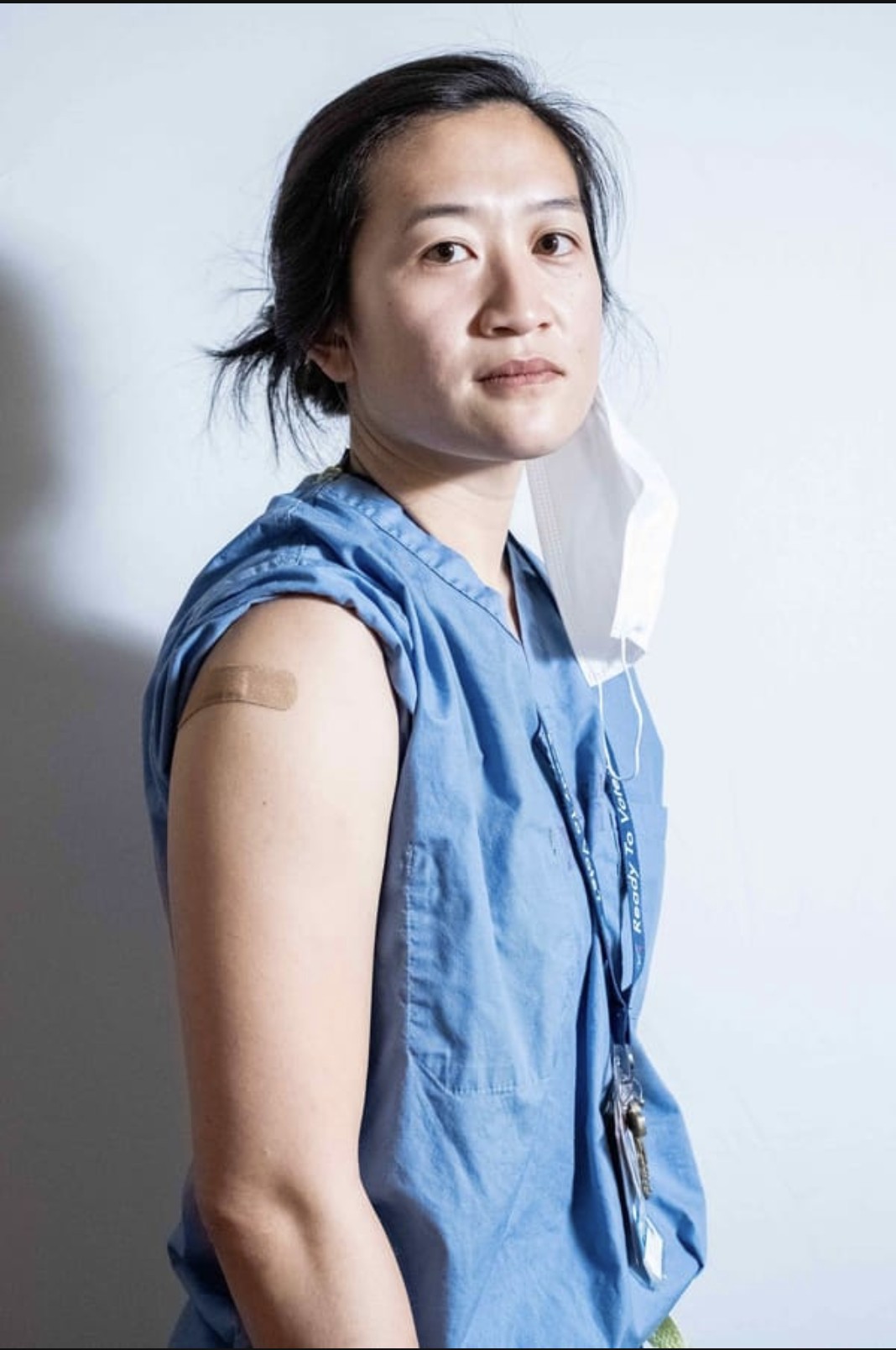 ER doctor with a bandage on her arm after a Covid-19 vaccine